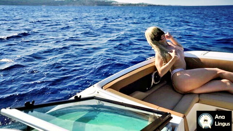 Topless skinny blonde with small tits lounges in tiny thong on luxury yacht at sea