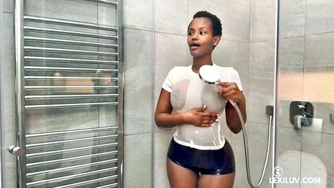 Ebony babe with big wet tits in see-through shirt showers her curves