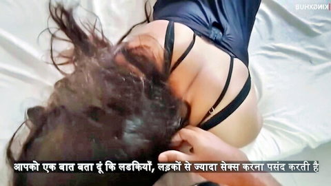 Desi Indian girlfriend in black lingerie on bed, teasing pose with long hair