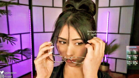 Gigi Ulala teasing with glasses in seductive pose
