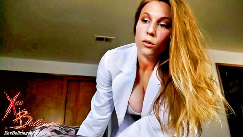 Blonde MILF teasing with massive tits spilling from open white blazer cleavage