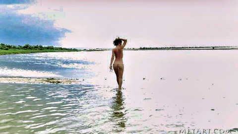 Nude brunette with bare ass and pussy tease wading in shallow beach water from behind