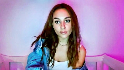 Busty slim brunette babe teasing in tank top and denim jacket