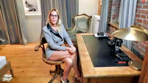Blonde Miley Weasel in sexy office blazer and short skirt, teasing at desk