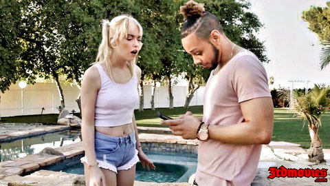 Blonde teen babe in tiny shorts gapes mouth at BBC stud showing phone by pool