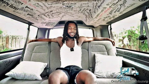 Muscular black man with dreads in tank and shorts for Eden's BBC Fan Bus scene