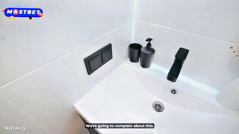 White bathroom sink with black faucet, soap dispenser, and Mostbet watermark overlay text 'We're going to complain about this'