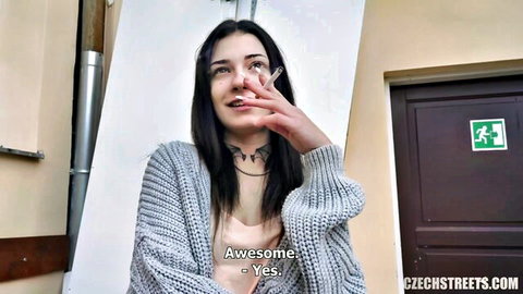 Brunette teen in cardigan smokes cigarette seductively on Czech street pickup