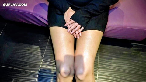 Petite Asian brunette spreads legs hands clasped over pussy teasing crotch