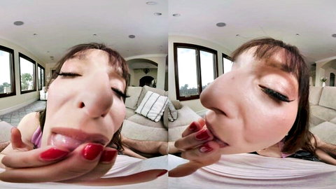 POV close-up of mature brunette with open mouth and tongue out, teasing oral