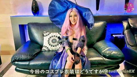 Pink-haired cosplay girl in revealing top kissing man passionately