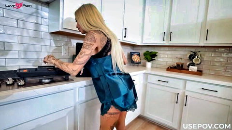 Tattooed blonde stepmom in blue lingerie bending over kitchen POV