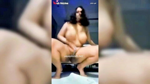 Horny Gulf Arab woman squatting and inserting cucumber in pussy