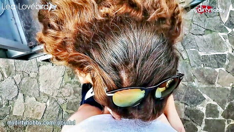 Buxom German redhead in sunglasses teases with cleavage in steamy Brazzers scene