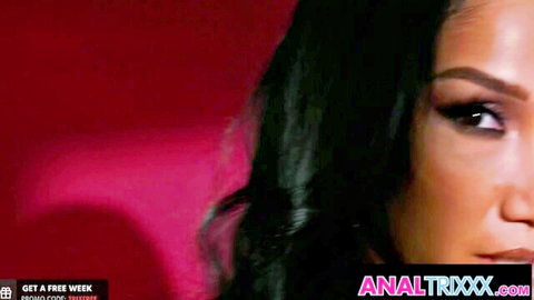 Vicki Chase seductive close-up with sultry eyes and red lips in interracial adult scene