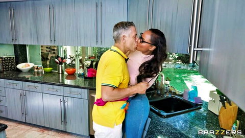 Interracial couple in passionate kitchen kiss, Brazzers body suits tease