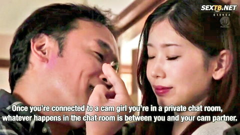 Intimate East Asian couple smiles as man touches cam girl's plump lips in private chat closeup