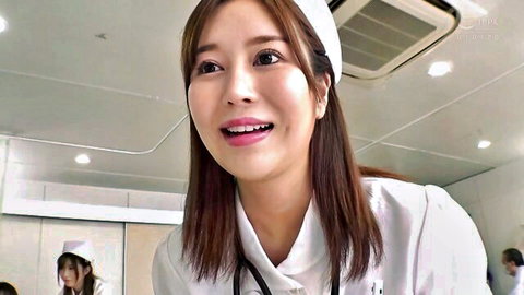 Smiling Asian nurse in white uniform and stethoscope