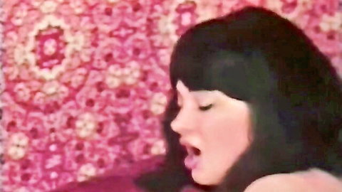 Vintage Tabu Film close-up of black-haired woman moaning passionately