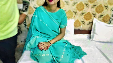 Punjabi step-mom in turquoise saree sits seductively on bed with Indian lover