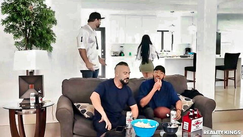 The Official Egypt in short dress with guys on couch game day fun