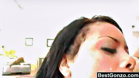 Ebony woman close-up with cum-glazed face and open mouth