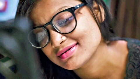 Seductive Desi Indian bhabhi in glasses, smiling closeup for hardcore stepdad stepdaughter video
