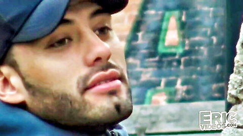 Bearded Latino guy in cap on urban street for gay outdoor threesome