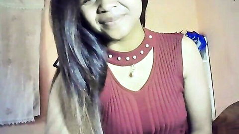 Smiling Malagasy MILF in red v-neck top, long dark hair portrait