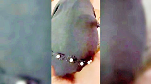 Homemade closeup of Asian hijab girl's beaded black headscarf from behind