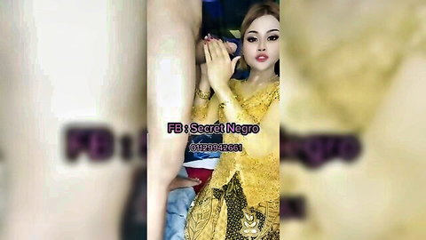 Malaysian Asian babe in yellow kebaya strokes thick black cock handjob