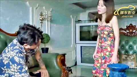 Asian woman in floral dress stands with seated beggar boyfriend in JAV scene