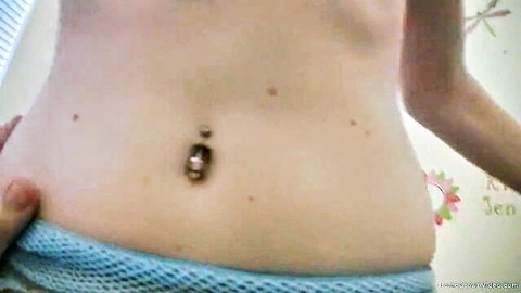 Skinny ginger teen teases with navel piercing and perky tits