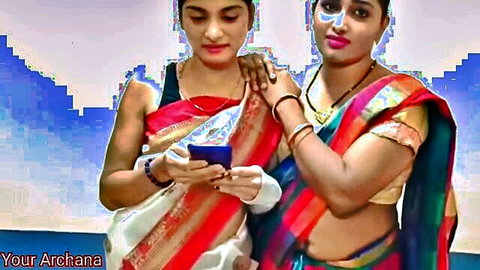 Two Indian aunts in colorful saris chatting on phone - Your Archana seduction