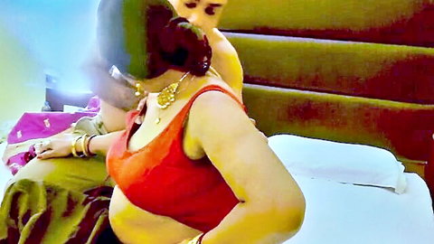Desi Indian couple in traditional saree and blouse, intimate anniversary tease