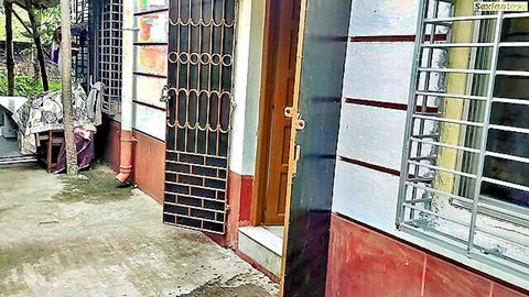 Teasing outdoor view of traditional Indian house entrance with wrought iron gate