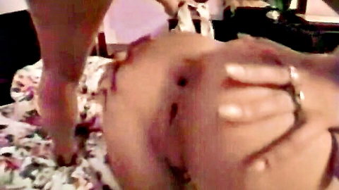 Fair skinned woman's wet shaved pussy and asshole spread wide by hand in doggy style on bed