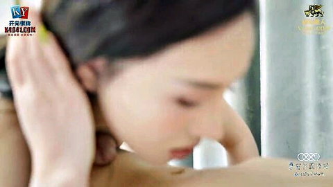 Asian wife in bathroom mirror, topless view during doctor massage session