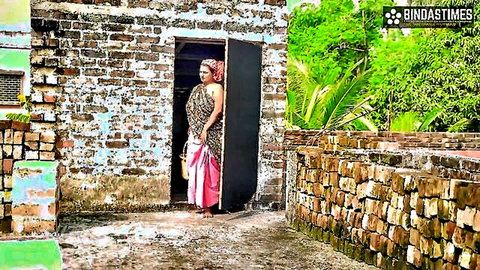 Desi stepmom in pink saree standing seductively by door, big boobs tease