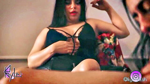 Curvy Latina in black strappy lingerie teases as bearded man watches
