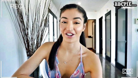 Emily Willis smiling in low-cut pink dress for online hookup
