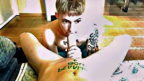 Tattooed young man sits on big dick in gay anal sex