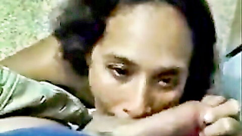 Mature black woman sucking thick cock deep in mouth close-up with lustful eyes
