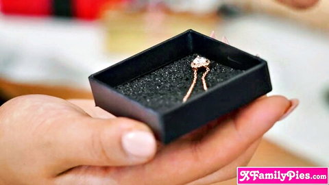 Scarlett Alexis' hand holding Xmas gift box with sparkling necklace, teasing Latina teen excitement