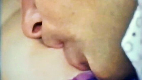 Vintage close-up of blonde woman sucking purple dildo in Tabu Film classic