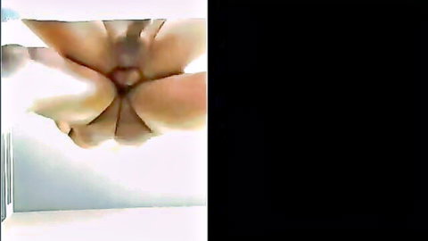 Closeup of smooth Asian ass spread wide exposing tight pink anus