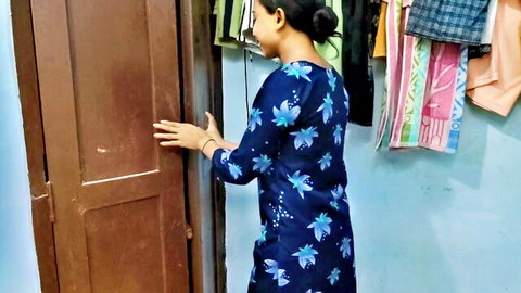 Indian woman in blue floral dress opening door, step sister tease vibe