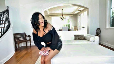 Mona Azar teasing in black off-shoulder top and mini skirt