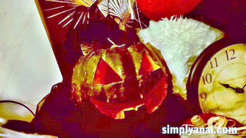 Spooky Halloween jack-o-lantern pumpkin with red balloon, fluffy decor, and vintage clock setup