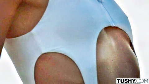 Curvy ebony woman in revealing white cutout bodysuit